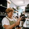 Older woman working at coffee shop